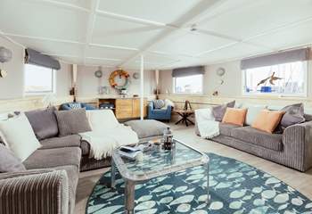 Wander through into the open plan living space where the natural light streams effortlessly in.