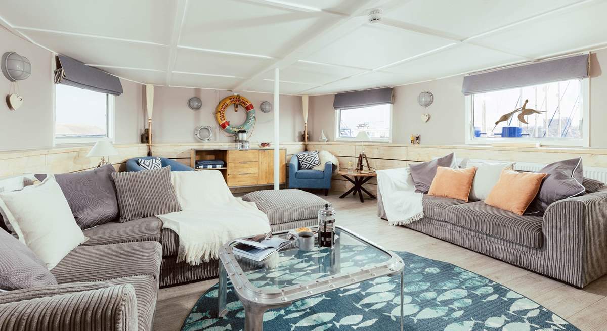 Wander through into the open plan living space where the natural light streams effortlessly in.