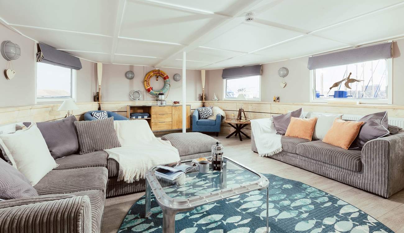 Wander through into the open plan living space where the natural light streams effortlessly in.