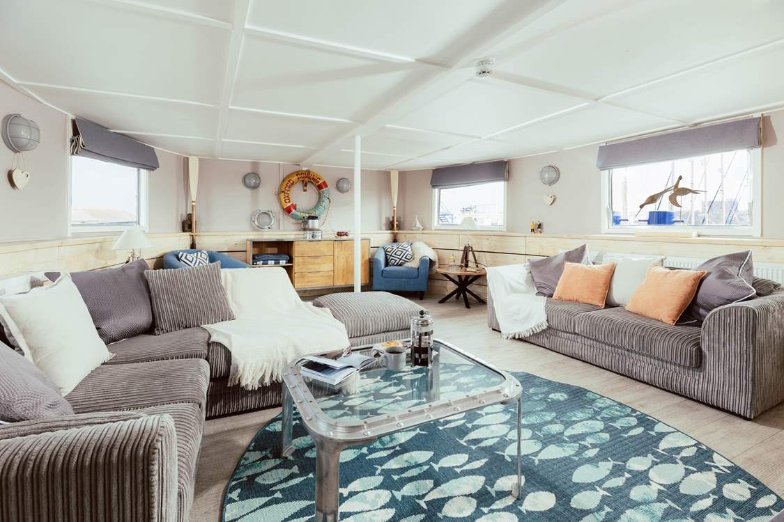 Wander through into the open plan living space where the natural light streams effortlessly in.