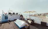 The two-tiered decking offers you a place to relax and unwind with the carpet of sea around you. - Thumbnail Image