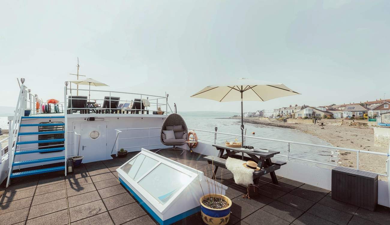 The two-tiered decking offers you a place to relax and unwind with the carpet of sea around you.