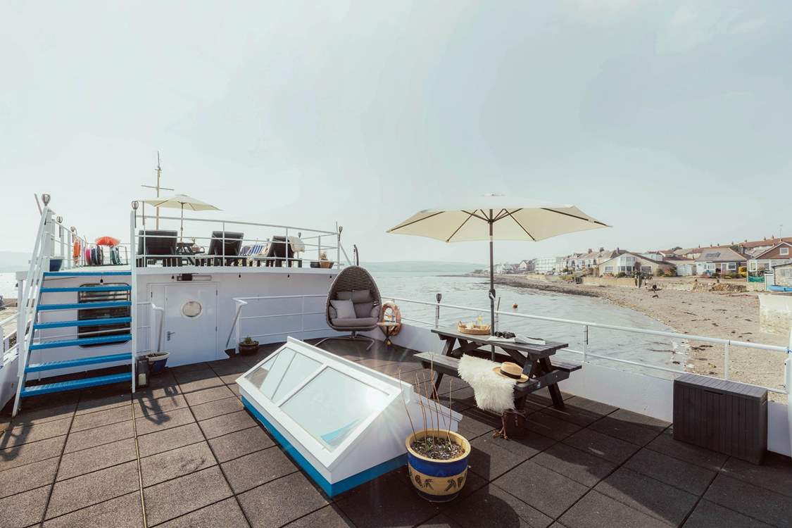 The two-tiered decking offers you a place to relax and unwind with the carpet of sea around you.