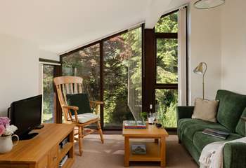 Nestled in the canopy of trees.