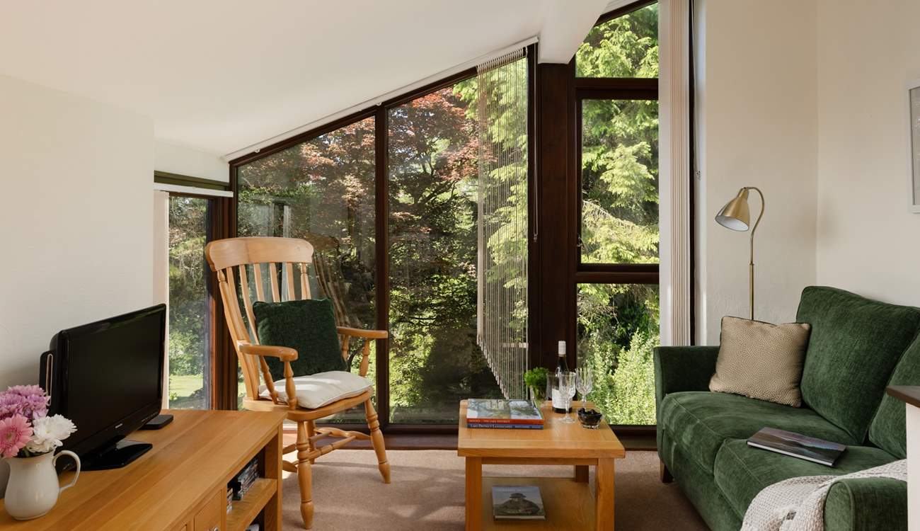 Nestled in the canopy of trees.