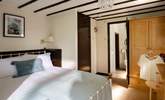 The comfortable double bedroom has its own en suite. - Thumbnail Image