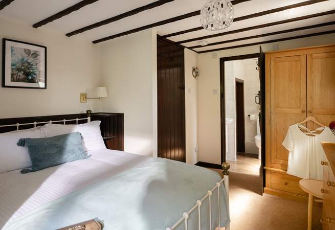The comfortable double bedroom has its own en suite.