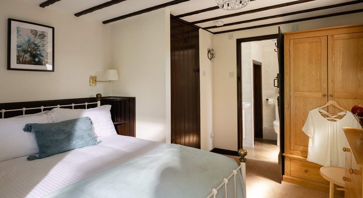 The comfortable double bedroom has its own en suite.