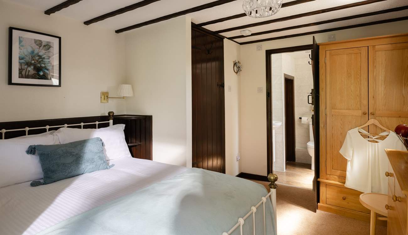 The comfortable double bedroom has its own en suite.