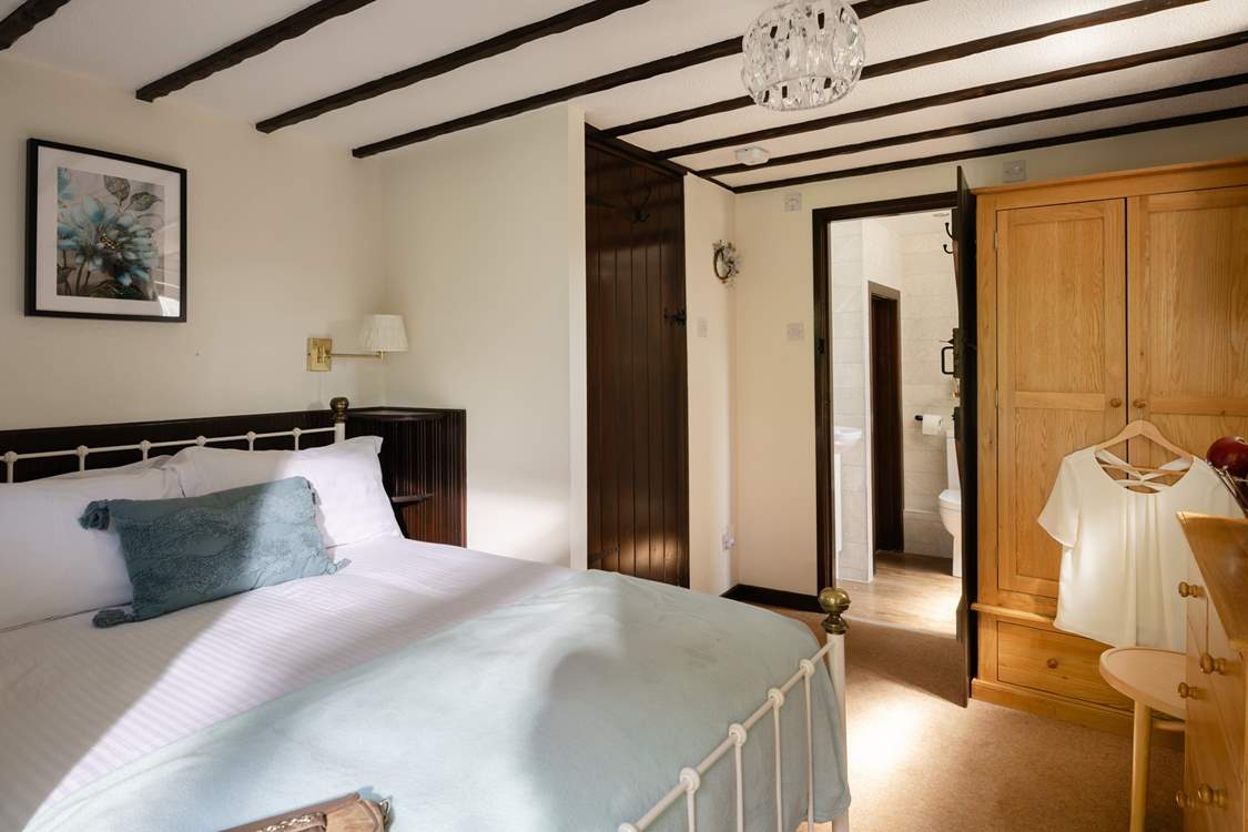 The comfortable double bedroom has its own en suite.