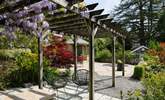 Sit in dappled shade under the pergola. - Thumbnail Image