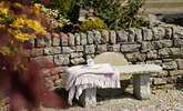 A rustic bench for a quiet moment. - Thumbnail Image