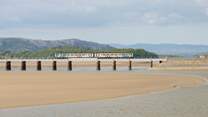 The trainline over the beach at Grange-over-Sands.