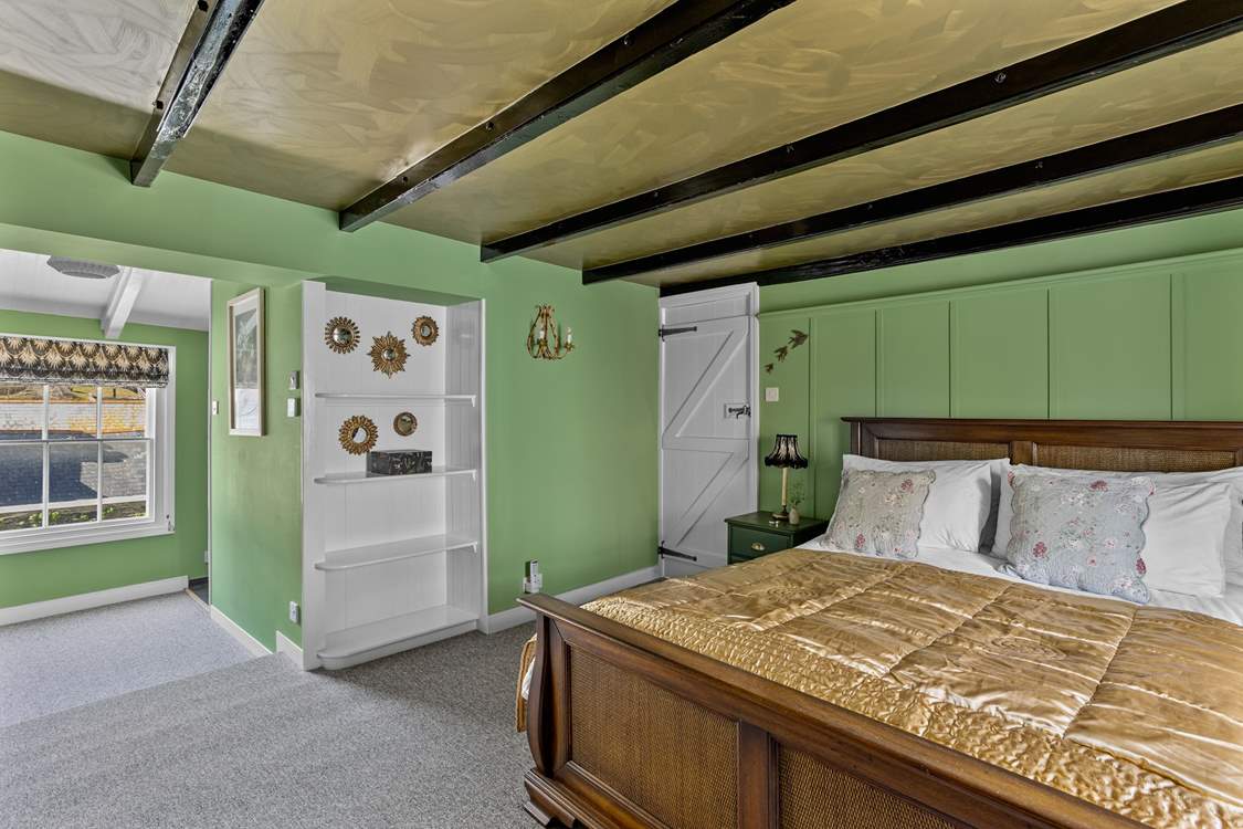 Bedroom 1 is surprisingly spacious for a traditional cottage.