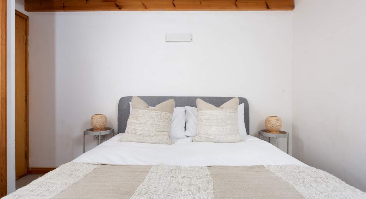 When bedtime calls, a king-size bed awaits to cradle you to sleep.