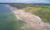 When the tide is out, the beach below stretches for miles and miles. - Thumbnail Image