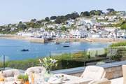 To the right the pretty village centre, to the left across the water to Place Manor and St Anthony headland.