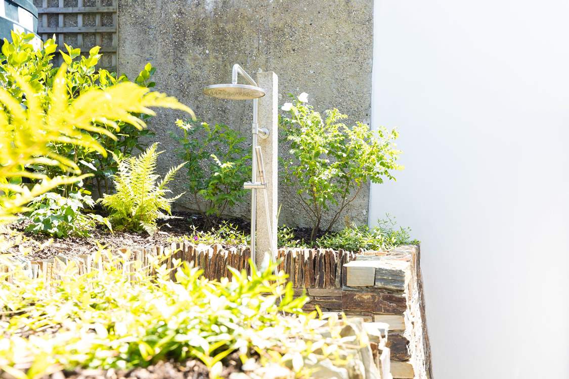 Rinse wetsuits and sandy toes in the outdoor shower.