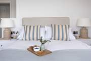 Beautiful linens await in each bedroom.