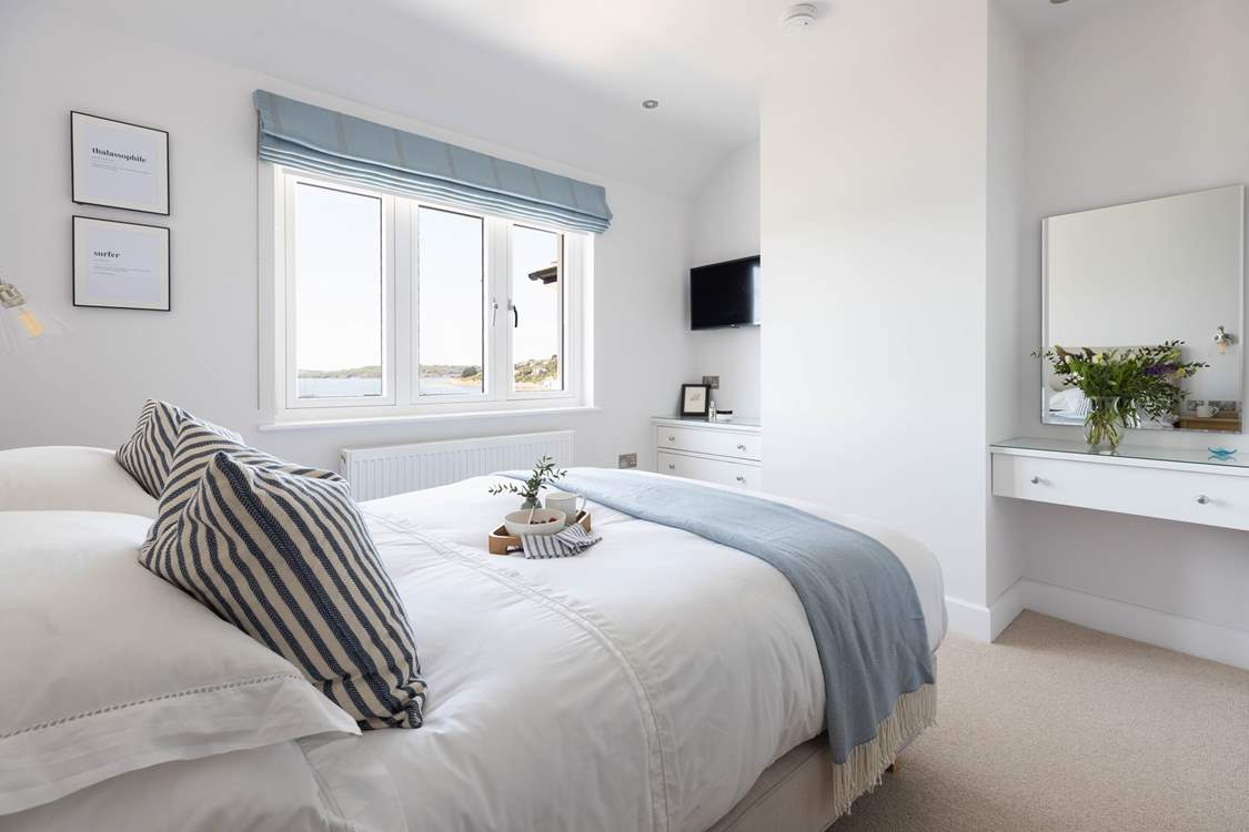 Both double bedrooms have magical views across St Mawes harbour and beyond.