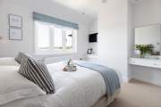 Both double bedrooms have magical views across St Mawes harbour and beyond.