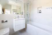 The family bathroom has a bath with shower over, ideal for a long soak.
