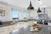The magnificent kitchen with views of the sea.