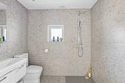 There is also a handy wet-room on the ground floor to wash away those sandy toes.