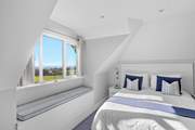 Bedroom 5 has a king-size bed and a single bed, perfect for a small family within the larger group.