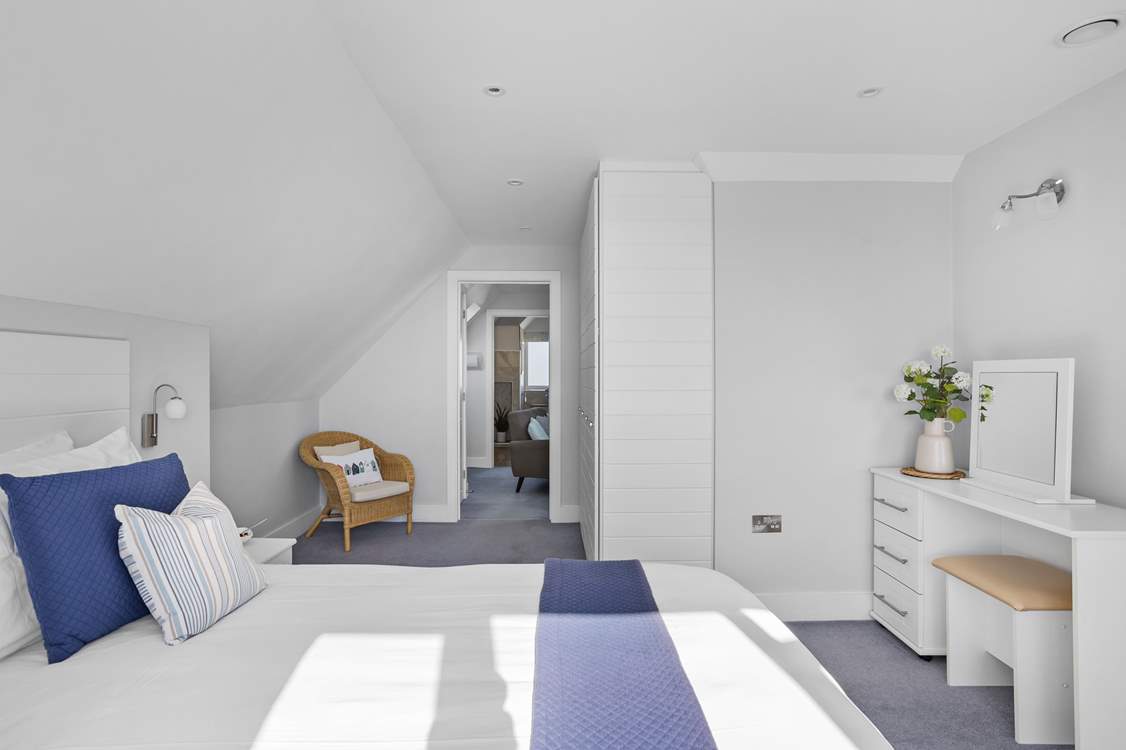 Bedroom 4 is perfect for those wanting extra space. This room leads through to your very own snug complete with sofa and TV.