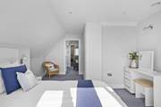 Bedroom 4 is perfect for those wanting extra space. This room leads through to your very own snug complete with sofa and TV.