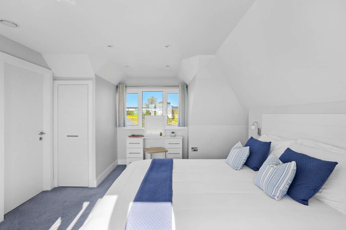 Another view of bedroom 5. The en suite is through the door to the left.