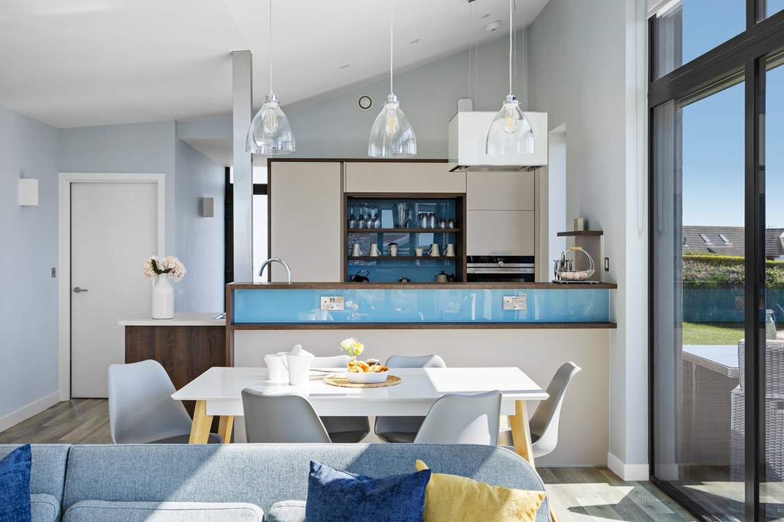 The modern sleek kitchen is fully equipped.