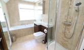 The stylish family bathroom has a bath and separate shower cubicle.  - Thumbnail Image