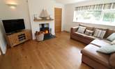 Relax in the sitting-room and light the wood-burner at cooler times of the year.  - Thumbnail Image