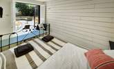 This gorgeous double bedroom is on the ground floor with doors leading to the patio. - Thumbnail Image