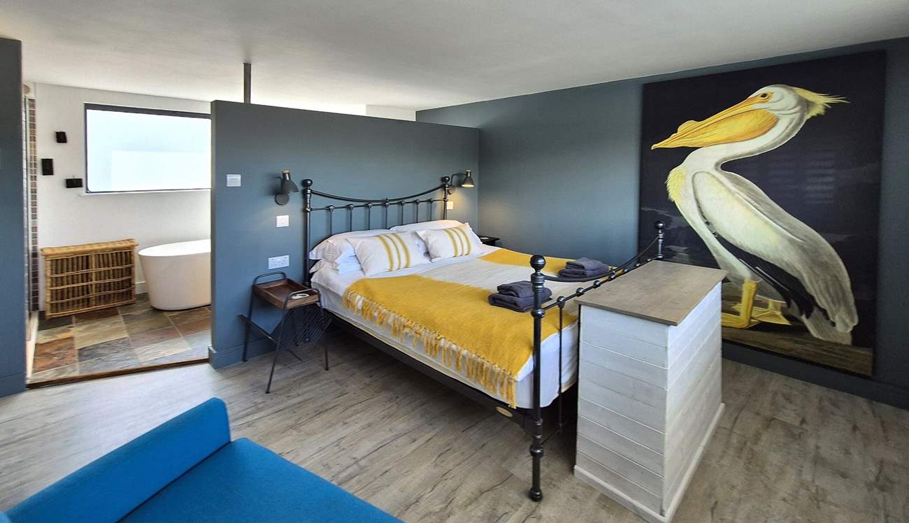 The gorgeous bathroom with free-standing bath sits behind the screen in bedroom 4 on the first floor.