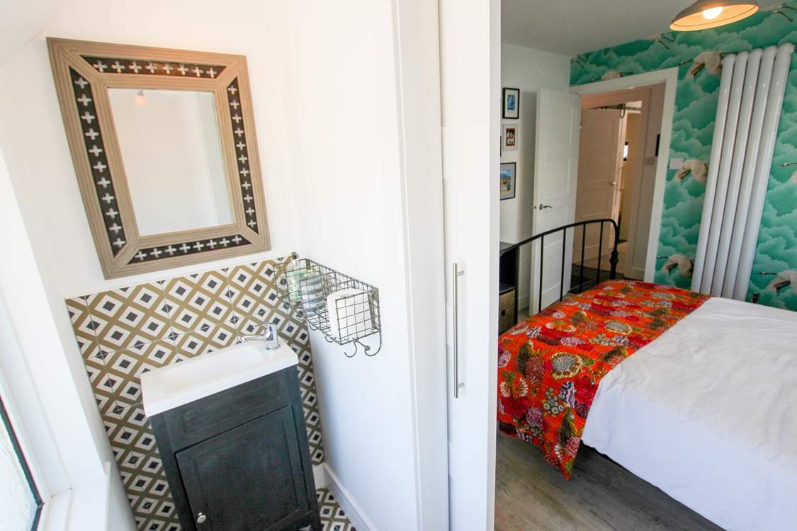 This bedroom has a cloakroom too.