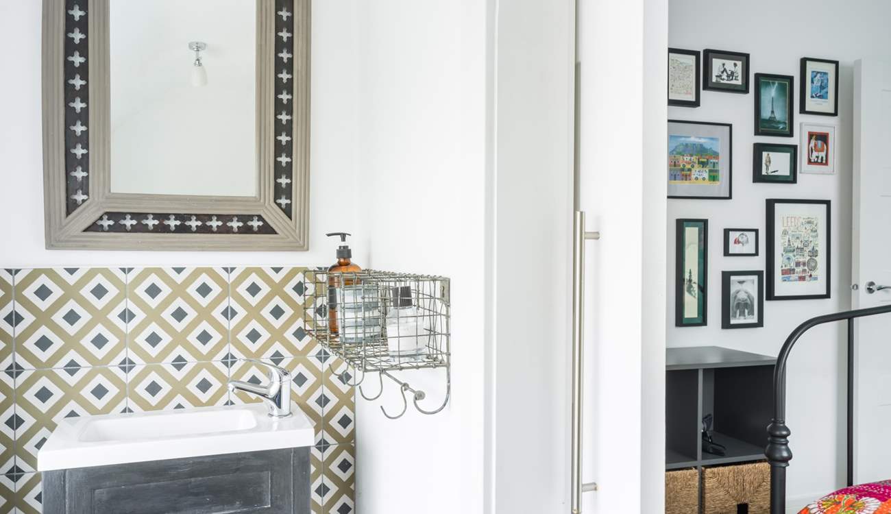 The cloakroom sits behind an envelope door.