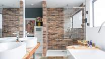 This en suite bathroom is both gorgeous and spacious. The WC is in a separate room for privacy. 