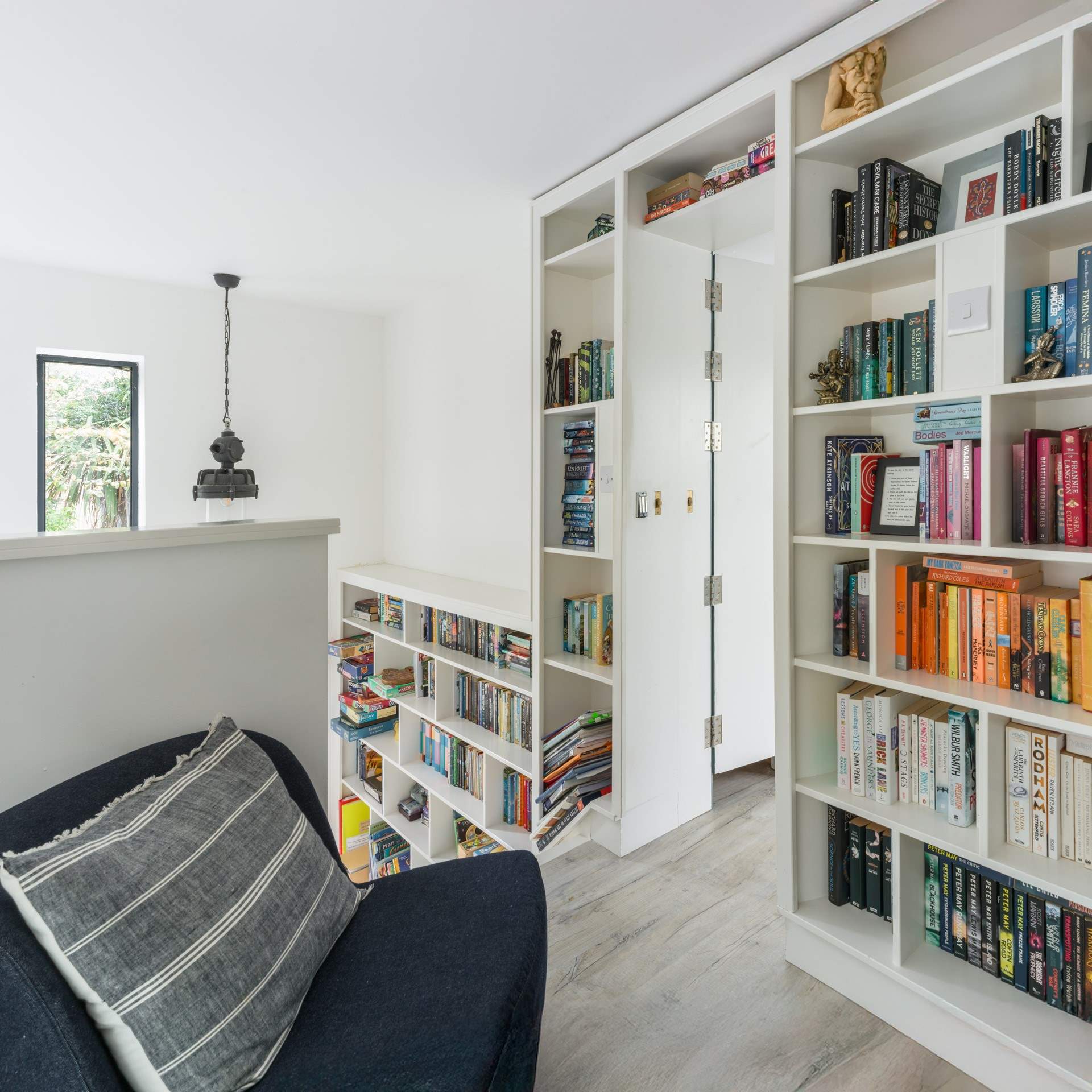 Push open the secret door and head on in to the first floor bedroom.