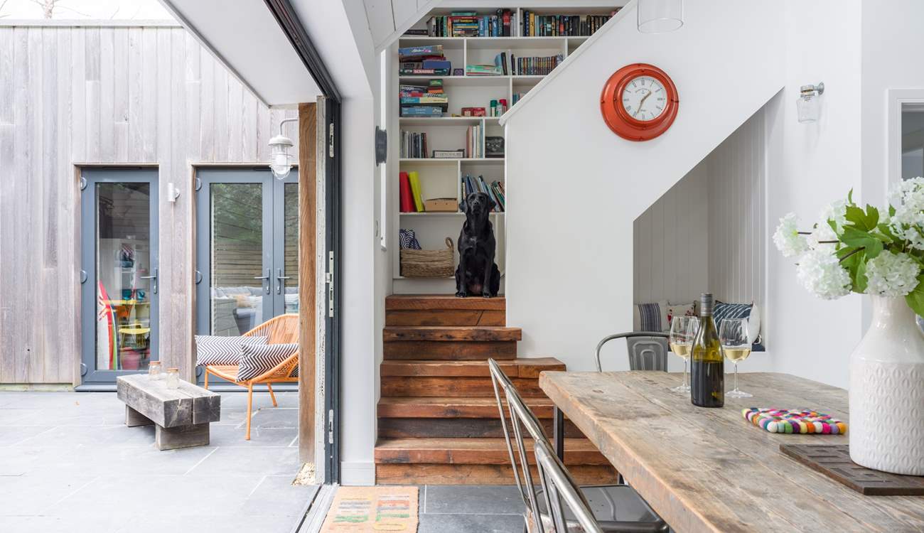 Pass the little reading nook and head upstairs to discover the secret library door. 