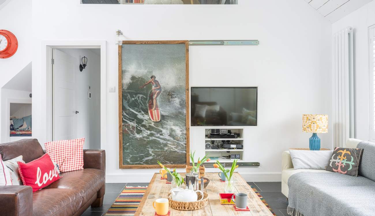 Slide the picture back when it's time for the family film night.