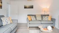 Relax into one of the comfy sofas after a day on the beach.