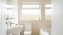 Rinse off those sandy toes in the family bathroom.