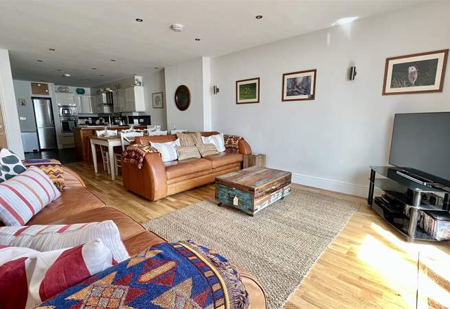 After a busy day, snuggle up on the sofas and watch a movie.