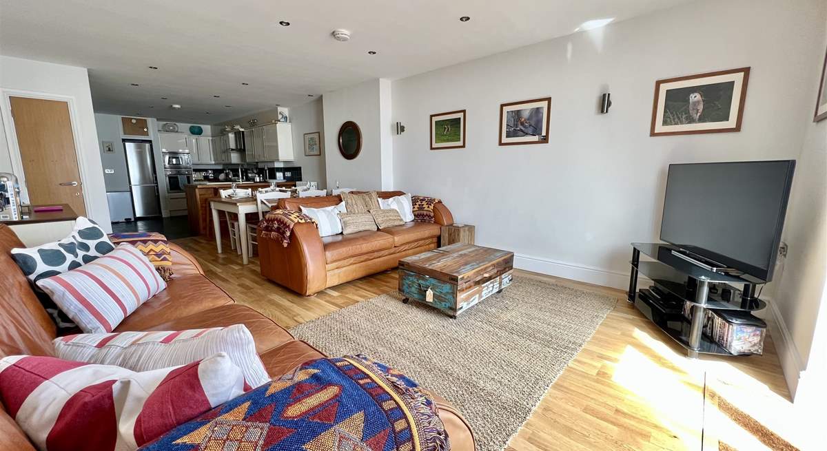 After a busy day, snuggle up on the sofas and watch a movie.