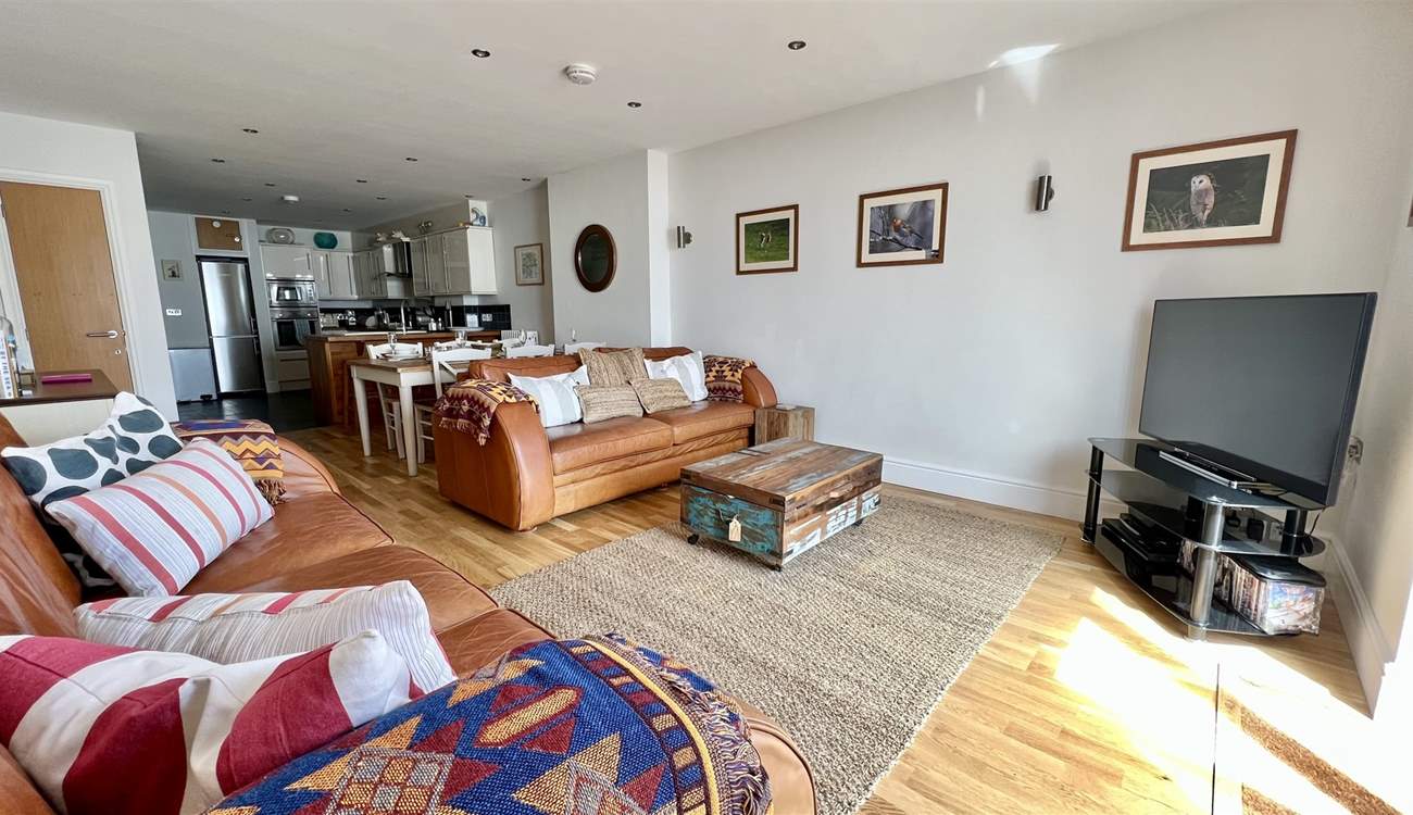 After a busy day, snuggle up on the sofas and watch a movie.