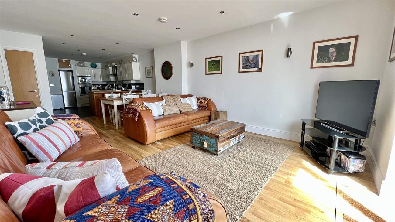 After a busy day, snuggle up on the sofas and watch a movie.
