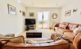 Relax in the open plan living space after a busy beach day.  - Thumbnail Image